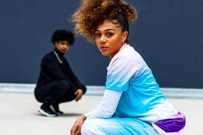 2 stylish woman squatting 