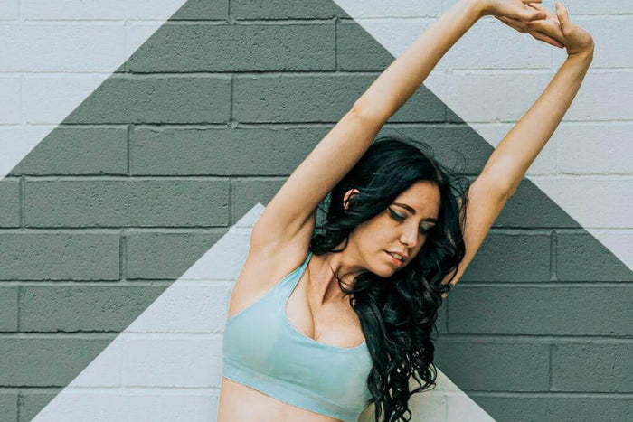 Woman stretching her back out 