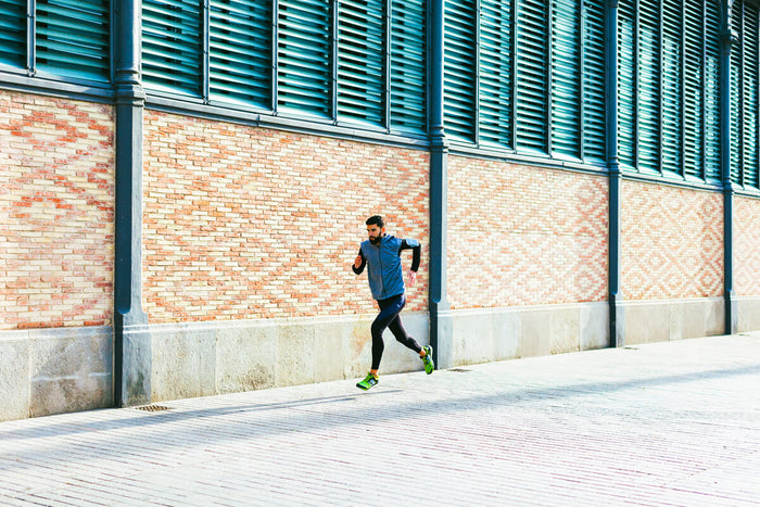 Man running a 5k to increase speed and stamina 