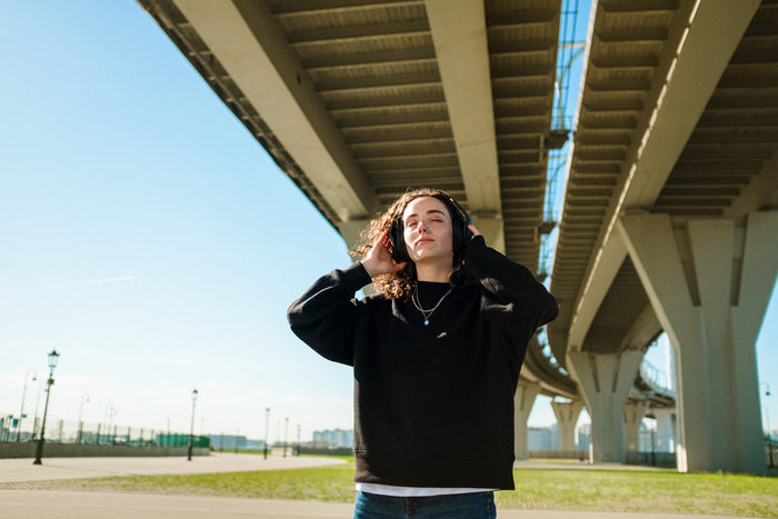 Woman listening to calming ASMR with headphones