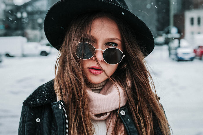 Woman staring into camera in the snow