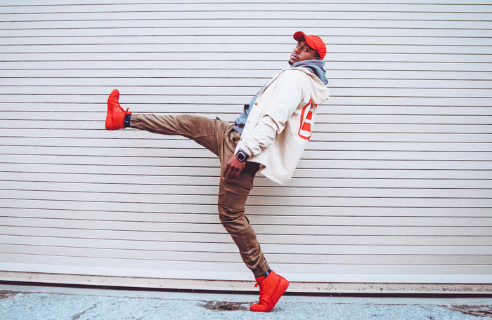 Man kicking in the air for Innermost