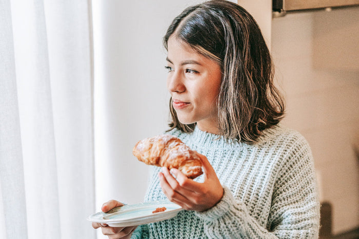 Women using phone to calculate macros