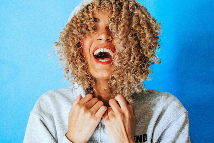 Woman laughing in the city 