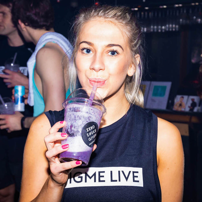 Digme fitness trainer drinking smoothie 