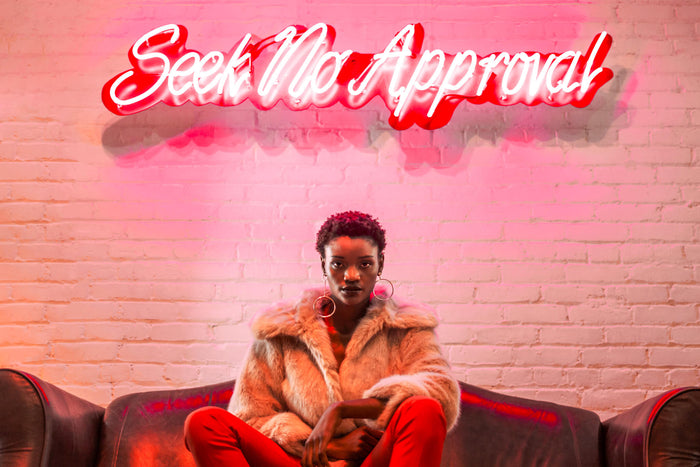 Woman sitting feeling empowered by Innermost