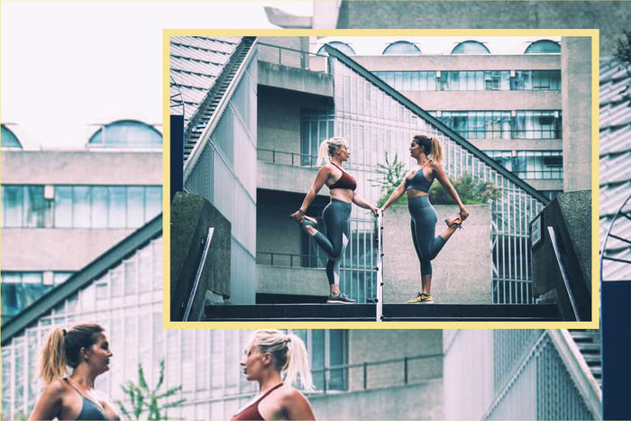 Trainers Kirsty Raynor & Alice Rickard stretching in urban setting