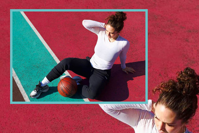 Lauren Schramm sitting on a basket ball court for Innermost 
