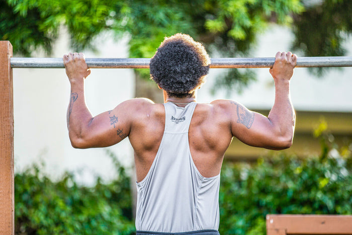 Man mastering the pull up exercise 