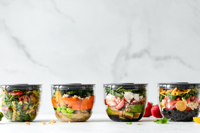 Four nutritious lunches in tupperware containers