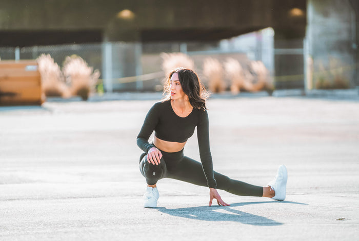 Woman stretching before cardio workout 