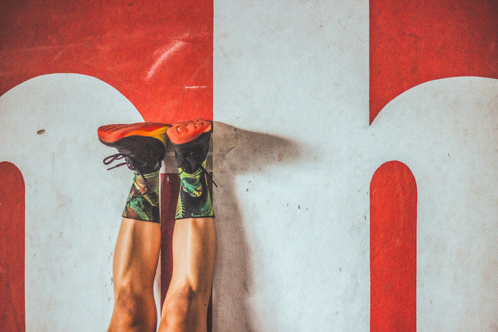 Close-up of man's legs on Gym floor