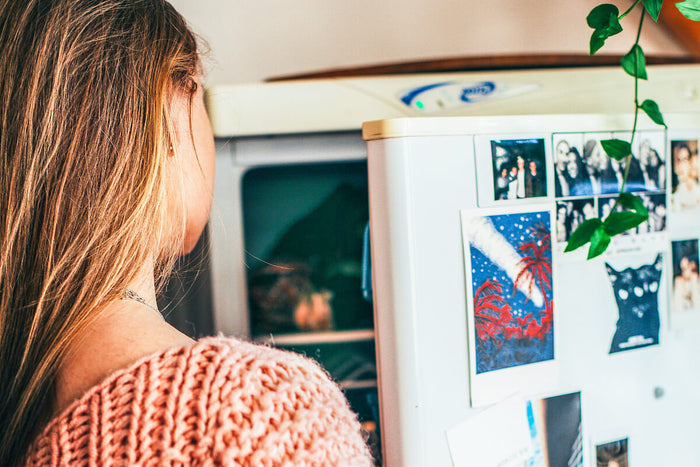 Woman looking in fridge 