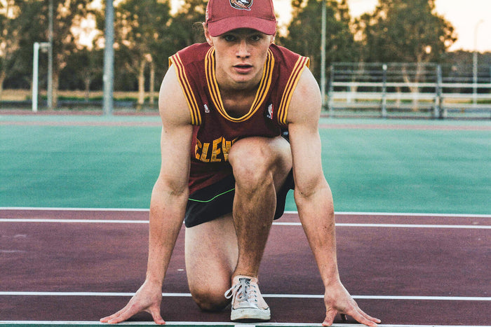 Athlete runner getting ready to race on racing track