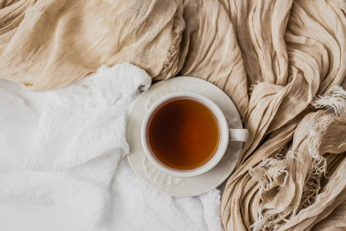 How to use caffeine to your advantage - cup of coffee with foam art