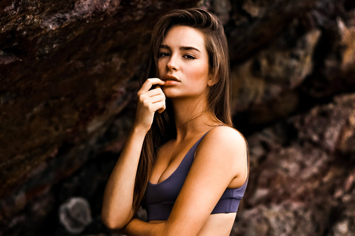 Woman posing for Innermost on the beach 
