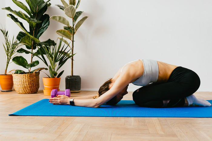 Woman stretching back in sustainable activewear 