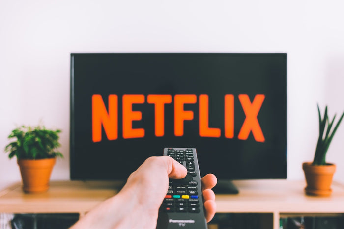 Remote control directed at TV on Netflix