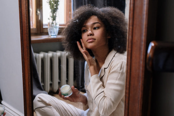 Woman applying collagen 