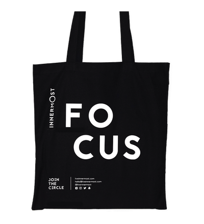 Innermost black cotton tote bag with FOCUS printed on it
