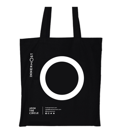Innermost black cotton tote bag with a large O printed on it